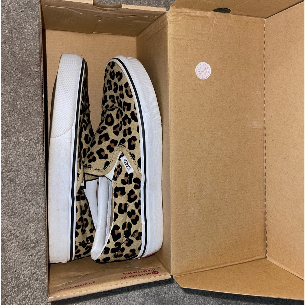 Worn leopard print slip vans
